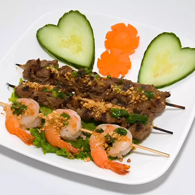 Stir fried lemongrass chicken with spring rolls on vermicelli, Okotoks AB